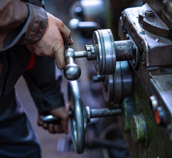 Man Operating Machine in Factory, Efficient Workforce in Action